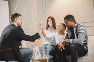 A family sitting together during a family therapy session