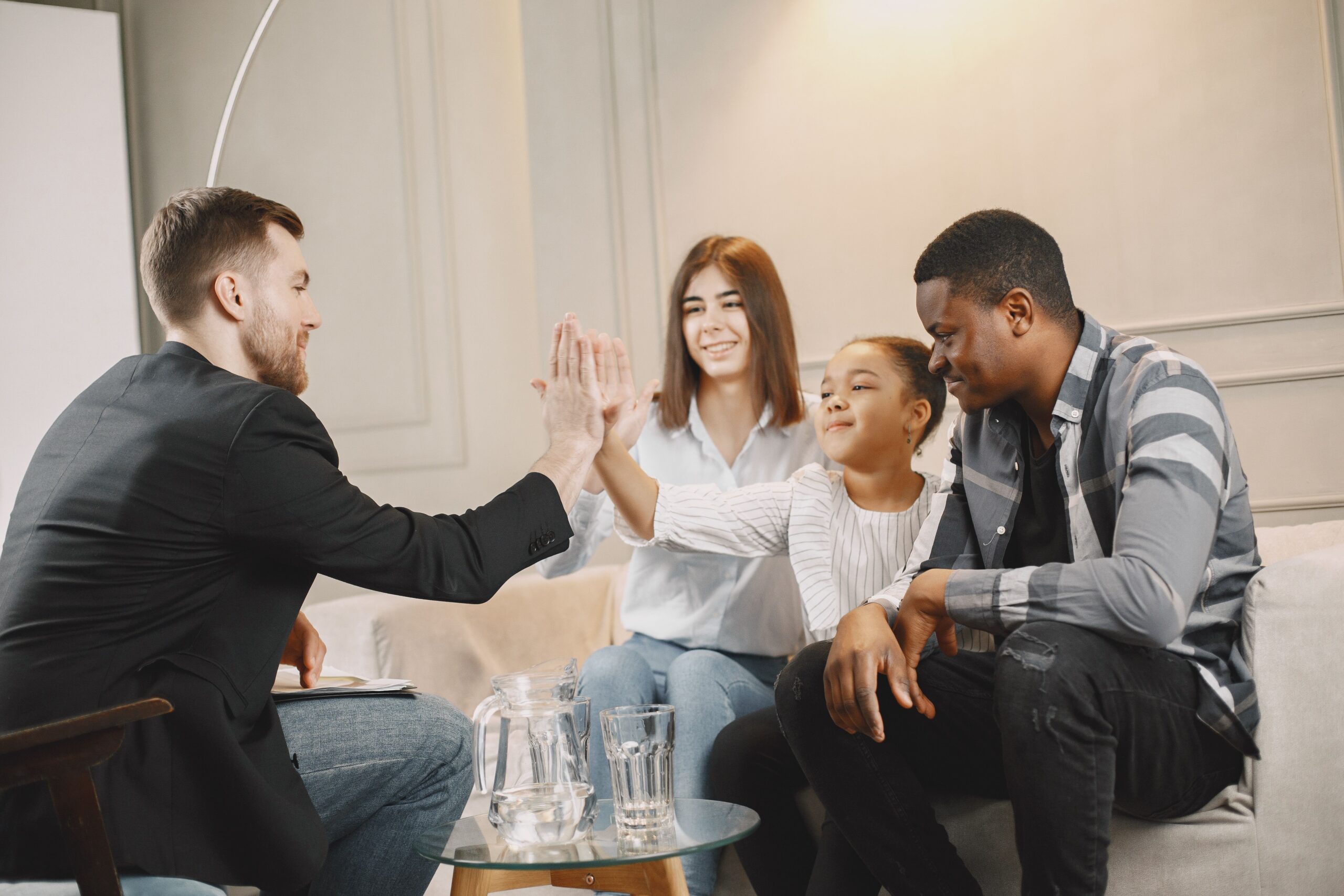 A family sitting together during a family therapy session