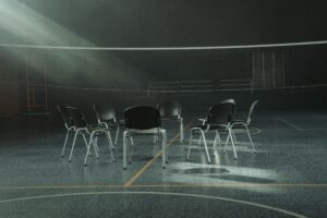 People participating in group therapy in a circle of chairs